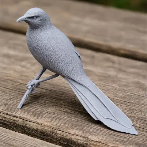 3D-printed model of a bird with detailed feathers, perched on a textured wooden surface.