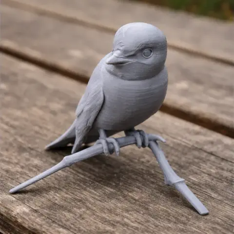 3D printed model of a bird perched on a branch, with detailed feather and eye features.