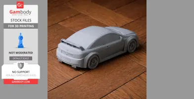 Gray 3D printed model of a Chevrolet Cobalt SS on a wooden surface.