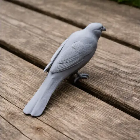 A detailed 3D-printed model of a bird perched on a wooden surface.