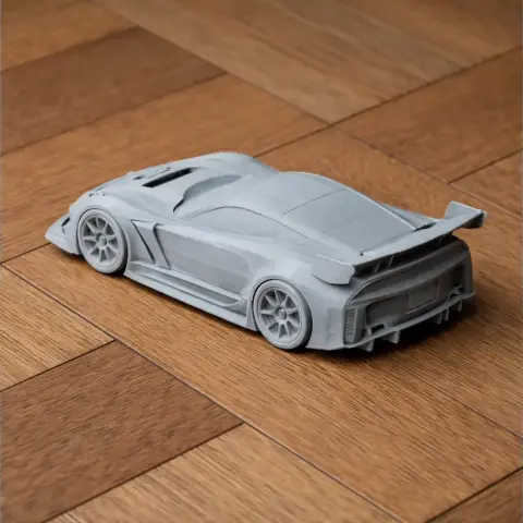 3D-printed Chevrolet Corvette C7.R model placed on a wooden surface.