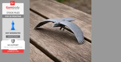 A detailed 3D printed model of a prehistoric bird in flight, with outstretched wings, on a wooden surface.