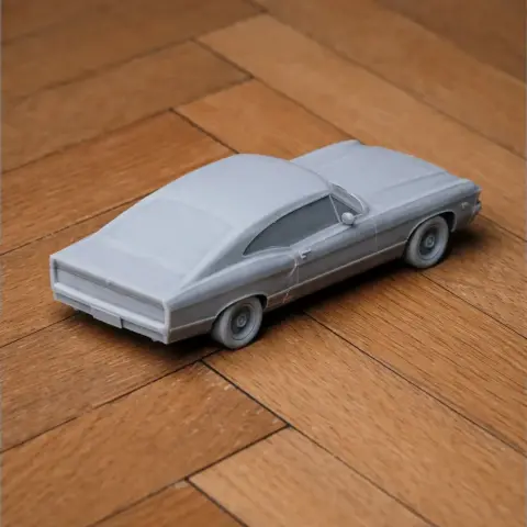 3D printed model of a Chevrolet Impala on a wooden surface.