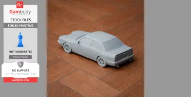A 3D printed model of a Chevrolet Monza car, unpainted, on a wood surface.