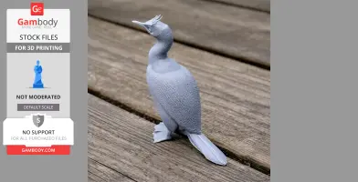 Gray 3D-printed model of an Auckland shag, a prehistoric bird, standing on wooden surface.