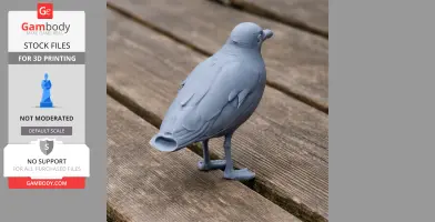 Gray 3D-printed model of a bird, resembling Audouin's gull, on a wooden surface.