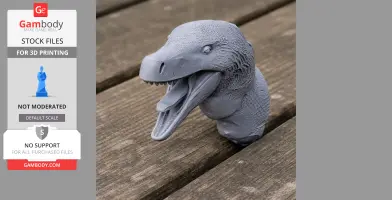 3D-printed blue Acheroraptor head with open mouth on wooden surface.