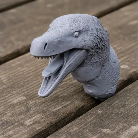 Gray 3D-printed Acheroraptor bust, detailed head with open mouth, textured scales, on wooden surface.