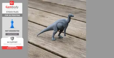 A gray 3D printed model of a dinosaur, Adelolophus, stands on a wooden surface.