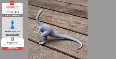 A gray 3D-printed model of a dinosaur with a long neck and tail stands on a wooden surface.