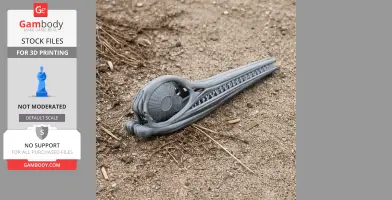 3D-printed Ophthalmosaurus skull model on sandy ground.