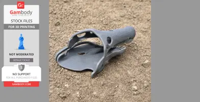 3D printed Oxalaia dinosaur skull model on a sandy surface.