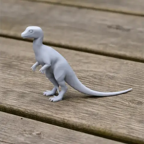 A 3D printed model of a small, bipedal dinosaur with a long tail and short arms, standing on a wooden surface.