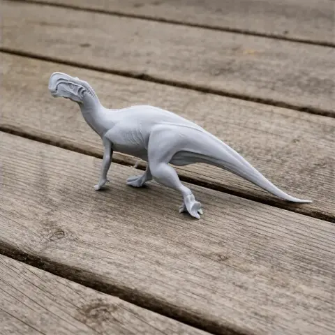 3D printed Altirhinus dinosaur model on wooden surface.