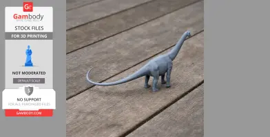 Gray 3D-printed long-necked dinosaur model on wooden surface.