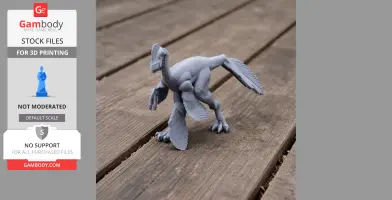Gray 3D-printed model of a prehistoric Anzu creature on a wooden surface.