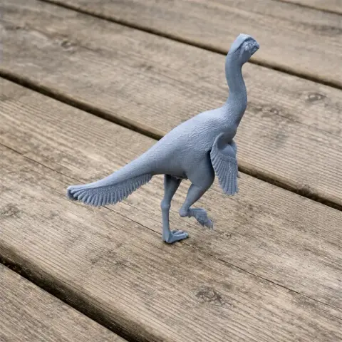 A detailed 3D-printed model of an Apatoraptor walking on a wooden surface.