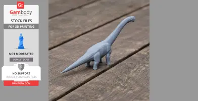 Gray 3D-printed model of a long-necked dinosaur on a wooden surface.