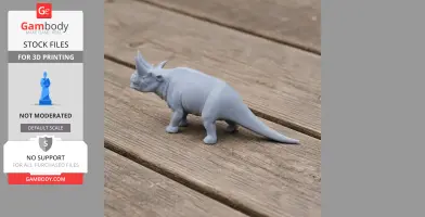 3D-printed gray Arsinoitherium model on wooden surface, showcasing prehistoric features.