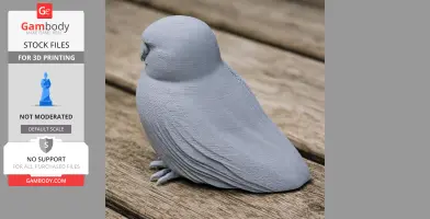 3D printed model of an Australian boobook owl, smooth texture, gray color, on a wooden surface.