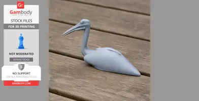 Gray 3D-printed Australian pelican model resting on a wooden surface.