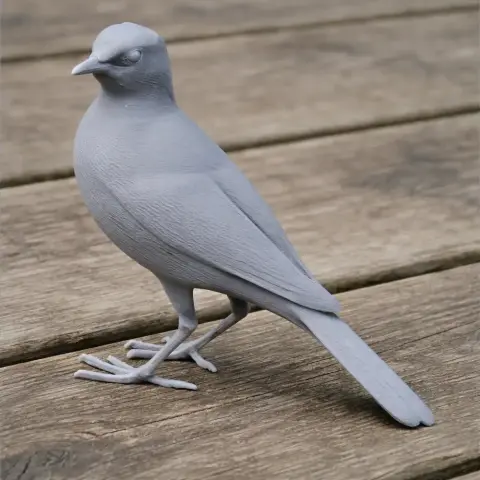 3D printed model of an Australian pipit bird, standing on a wooden surface.