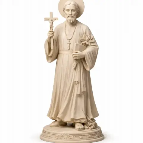 A devotional statue of a bearded figure in robes holding a cross and book, standing on a detailed base.