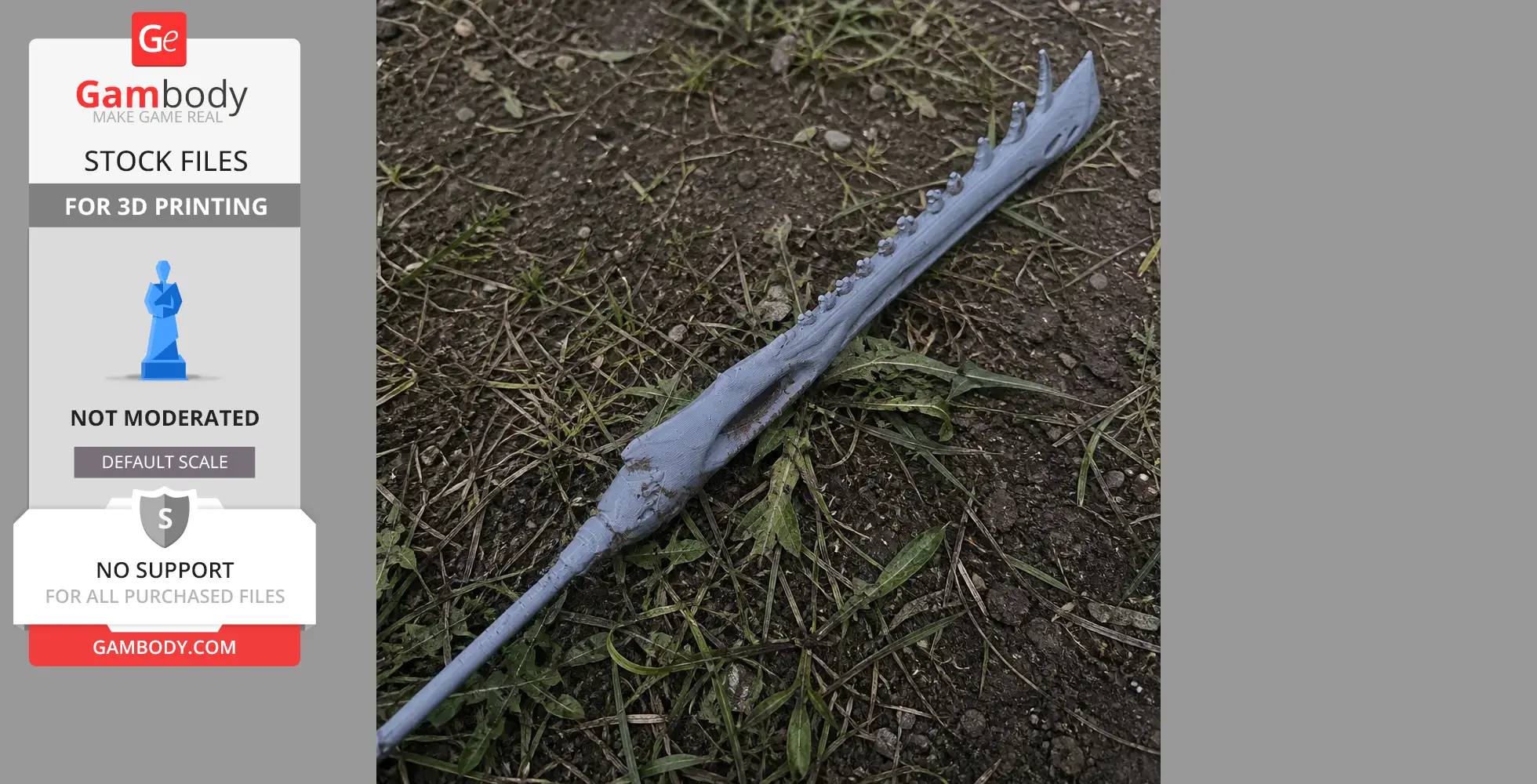 A 3D printed Giant Jawblade prop from Monster Hunter, resting on grass and dirt.