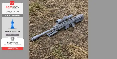 3D-printed sniper rifle prop with scope, resting on dry grass and soil.