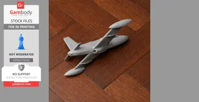 Gray 3D-printed model of an Aermacchi MB-326 jet on wooden floor.