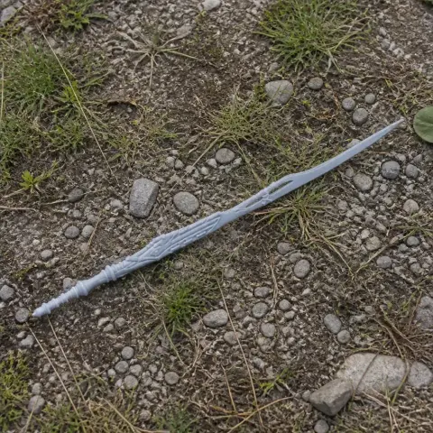 A detailed, ornate fantasy sword prop on a rocky ground, suitable for cosplay.