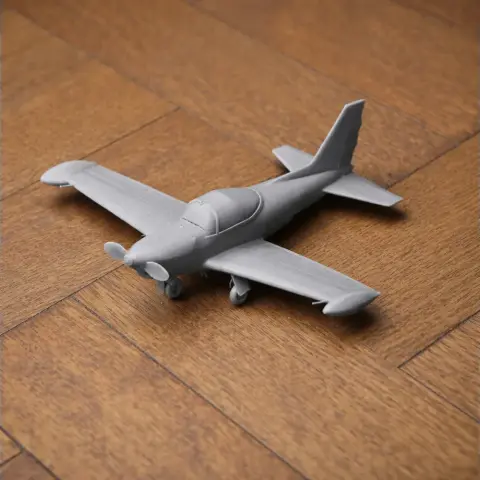 A small 3D-printed model of the Aermacchi SF.260 aircraft on a wooden surface.