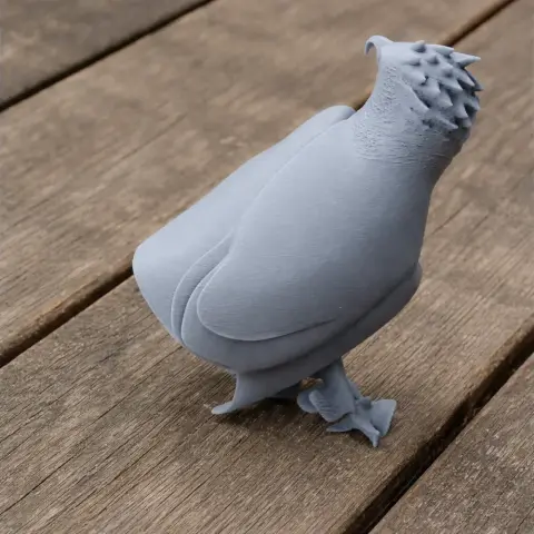 Gray 3D printed Ayres's hawk-eagle model with detailed feathers, standing on a wooden surface.