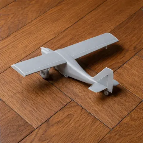 Gray 3D-printed model of a single-engine aircraft, resembling an American Champion Citabria.