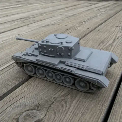 3D printed model of a Cromwell IV tank on a wooden surface.