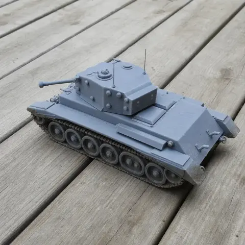 A detailed 3D printed model of a Cromwell tank on a wooden surface.
