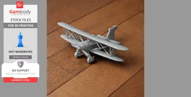 A 3D-printed model of a biplane on a wooden surface.