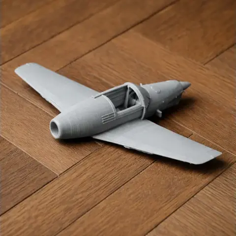 3D-printed model of Arado Ar 79 aircraft on a wooden surface.