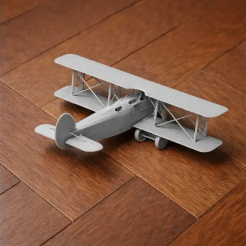 Model of a vintage biplane, the Avia BH-21, displayed on a wooden surface.