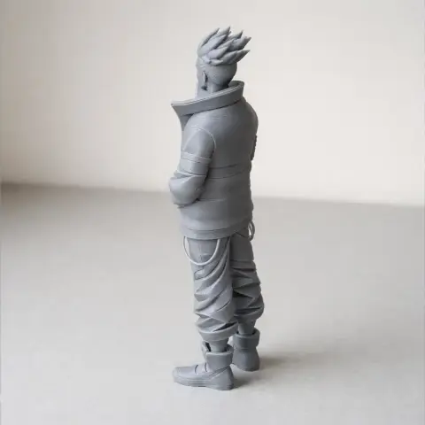 A stylized 3D figure with spiky hair, wearing a jacket and pants, hands in pockets, viewed from the side.
