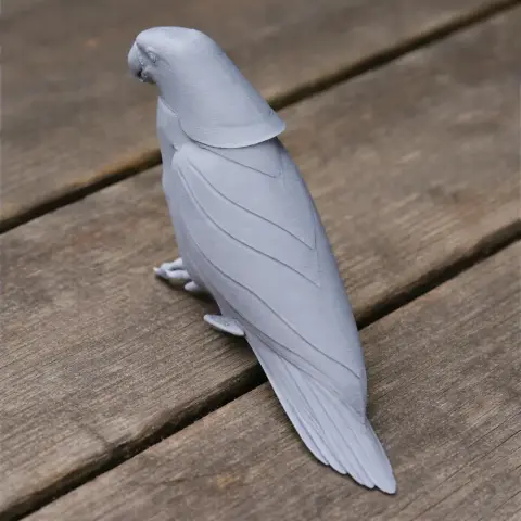 A detailed 3D-printed model of a parrot, viewed from the side, with intricate feather details.