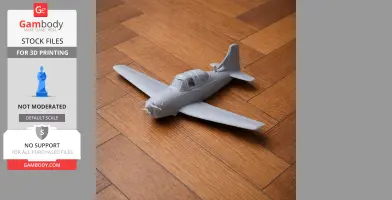 Gray 3D-printed model of a Beechcraft T-34 Mentor aircraft on a wooden floor.