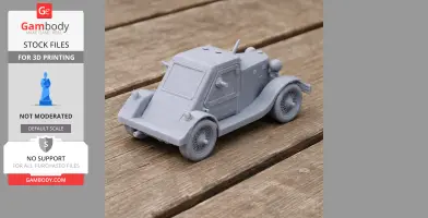 A detailed 3D-printed model of an armored car on a wooden surface.