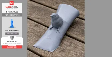A 3D-printed model of a sparrow perched on a curved surface, displayed on a wooden table.