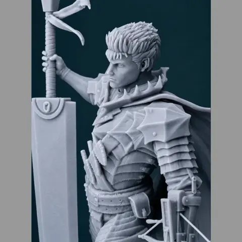 Warrior in armor, holding a large sword, with a detailed cape and spiky hair.
