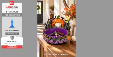 Halloween-themed organizer bowl with pumpkin, bats, and haunted houses, holding keys on a table.