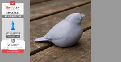 Gray 3D printed model of a bird, resembling a sparrow, resting on a wooden surface.