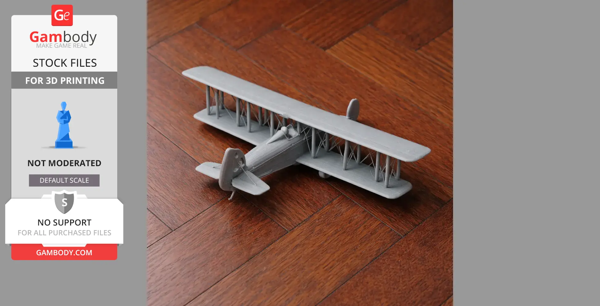 A gray 3D-printed model of a biplane displayed on a wooden floor.