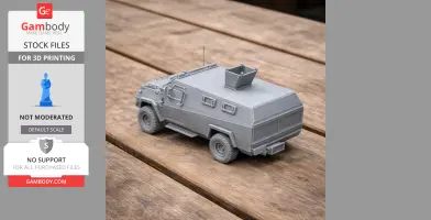 A detailed 3D-printed APC tank model on a wooden surface.