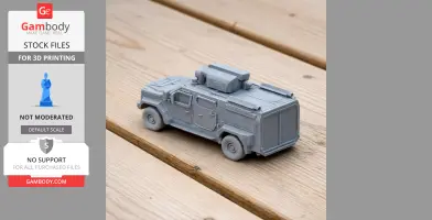 Gray 3D-printed model of the ILGAZ II 4x4 tank on a wooden surface.